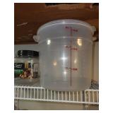 Collection of Mason Jars with Lids and Canning Supplies