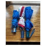 Assorted Compact Umbrellas and Beauty Accessories with Wicker Basket