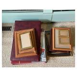 Collection of Wooden Picture Frames and Photo Albums