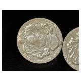 Two 2 Oz Silver Coins Featuring Lion Design