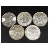 Five Silver Bullion Coins Featuring Various Designs and Minting Years
