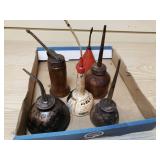 6 metal oiling cans