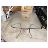 Glass top patio table