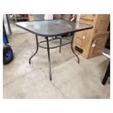 Glass top patio table