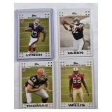 Lot of 4 2007 Topps Rookie Football Cards Featuring Marshawn Lynch, Greg Olsen, Patrick Willis, and Joe Thomas
