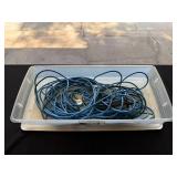 Collection of Blue Extension Cords in Storage Tub
