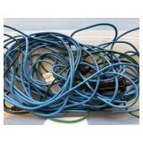 Collection of Blue Extension Cords in Storage Tub