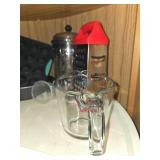 Assorted Kitchenware Collection Including Glass Bowls, Muffin Pan, and Grater