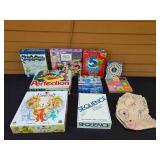 Collection of Board Games and a Dinosaur Mask