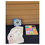 Collection of Board Games and a Dinosaur Mask