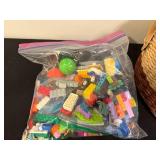 Assorted Household Items Including Storage Baskets and Toys