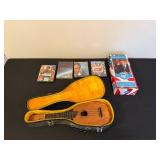 Ukulele with Vintage Case, President William J. Clinton Talking Figure, and 4 DVDs