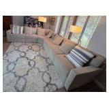 Large Sectional Sofa with Beige Upholstery and Striped Pillows - Rug Not Inc