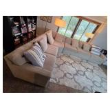 Large Sectional Sofa with Beige Upholstery and Striped Pillows - Rug Not Inc