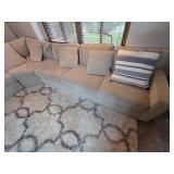 Large Sectional Sofa with Beige Upholstery and Striped Pillows - Rug Not Inc