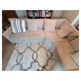 Large Sectional Sofa with Beige Upholstery and Striped Pillows - Rug Not Inc