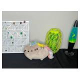 Collection of Decorative Items: Lava Lamp, Pusheen Plush, and more.