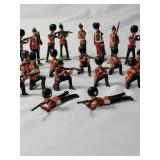 25-Vintage Red and Black Precast British Soldiers in battle. - Made by JO/HILLCO in the 50
