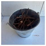 Old lock and Bucket of Old Nails