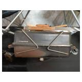 Collection of Camping Gear: Folding Chairs, Char-Broil Grill, and Bright Tote Bag