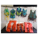 Collection of Assorted Life Jackets and Vests