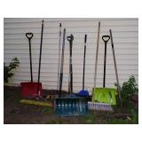 Collection of Snow Shovels, Rakes, and Brooms