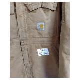 Assorted Workwear Including Carhartt Coveralls, Safety Vest, Boots, and Rain Suit