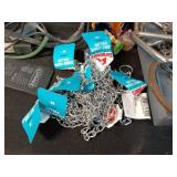 Assorted Pet Supplies Including Chains, Leashes, and Accessories