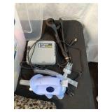 Mixed Household and Personal Care Items Including Foot Massager, Power Nebulizer, and Grooming Tools