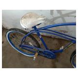 Collection of Garage Items: Folding Chairs, Bicycles, and Hand Trucks