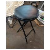 Collection of Garage Items: Folding Chairs, Bicycles, and Hand Trucks