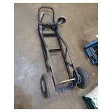 Collection of Garage Items: Folding Chairs, Bicycles, and Hand Trucks