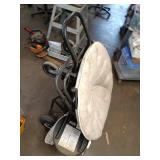 Collection of Garage Items: Folding Chairs, Bicycles, and Hand Trucks