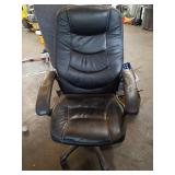 Varied Office and Household Items Including Chairs, Lamp, and Supplies