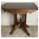 Victorian Hand Carved Parlor Table on Wheels with Marble Top