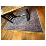 Intricately Patterned Area Rug with Fringed Edges