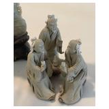Stone Buddha Statue and Three Wise Men Figurines