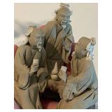 Stone Buddha Statue and Three Wise Men Figurines