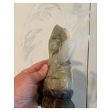 Stone Buddha Statue and Three Wise Men Figurines