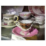 Collection of Vintage Porcelain Teacups and Plates with Floral and Scenic Designs