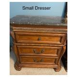 Small Dresser with Black Marble Top and Decorative Wood Carvings