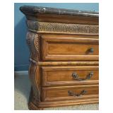 Small Dresser with Black Marble Top and Decorative Wood Carvings