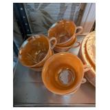 Set of Vintage Peach Lusterware Dishes with Plates, Bowls, and Cups