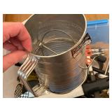 Collection of Kitchen Utensils and Tools in Storage Bin