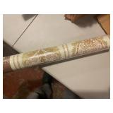 Collection of Vintage Wallpaper Rolls with Various Patterns