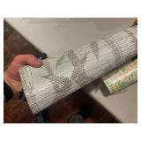 Collection of Vintage Wallpaper Rolls with Various Patterns