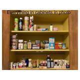 Collection of Vintage Spice Tins, Extracts, and Baking Ingredients