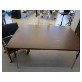 TABLE AND CUSHIONED CHAIR