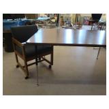 TABLE AND CUSHIONED CHAIR