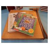 OVERSIZED PAPERCUTTER AND BOOKS